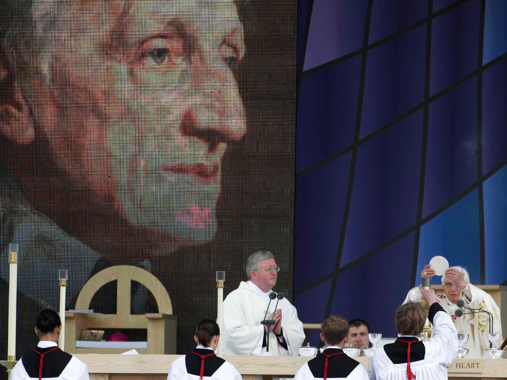 Pope Benedict XVI, right, celebrates a beatification mass for Cardinal John Henry Newman in Birmingham, England, Sunday, Sept. 19, 2010. (AP/Gregorio Borgia)