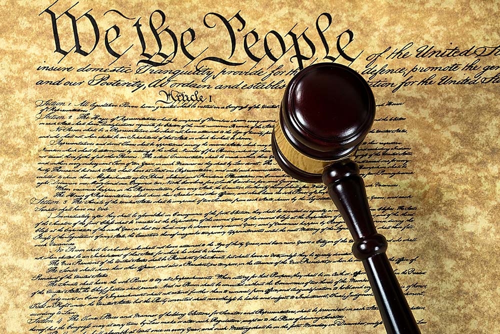 A gavel on top of a copy of the Constitution of the United States (Dreamstime/Maria Dryfhout)
