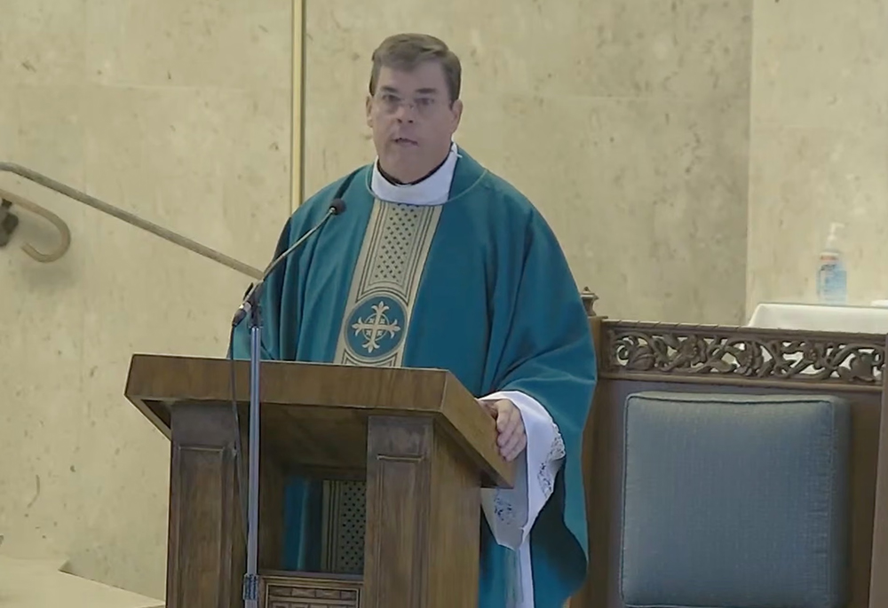 Fr. Robert Sullivan told his congregation he was taking a leave of absence on Aug. 3. (The Guardian/YouTube)