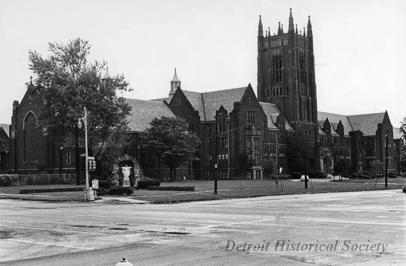 A circa 1970s black and white photographic print depicts Sacred Heart Seminary from the corner of West Chicago Boulevard and Linwood Street in Detroit. A statue of Mary sits in the corner of the lawn. (Courtesy of Detroit Historical Society)