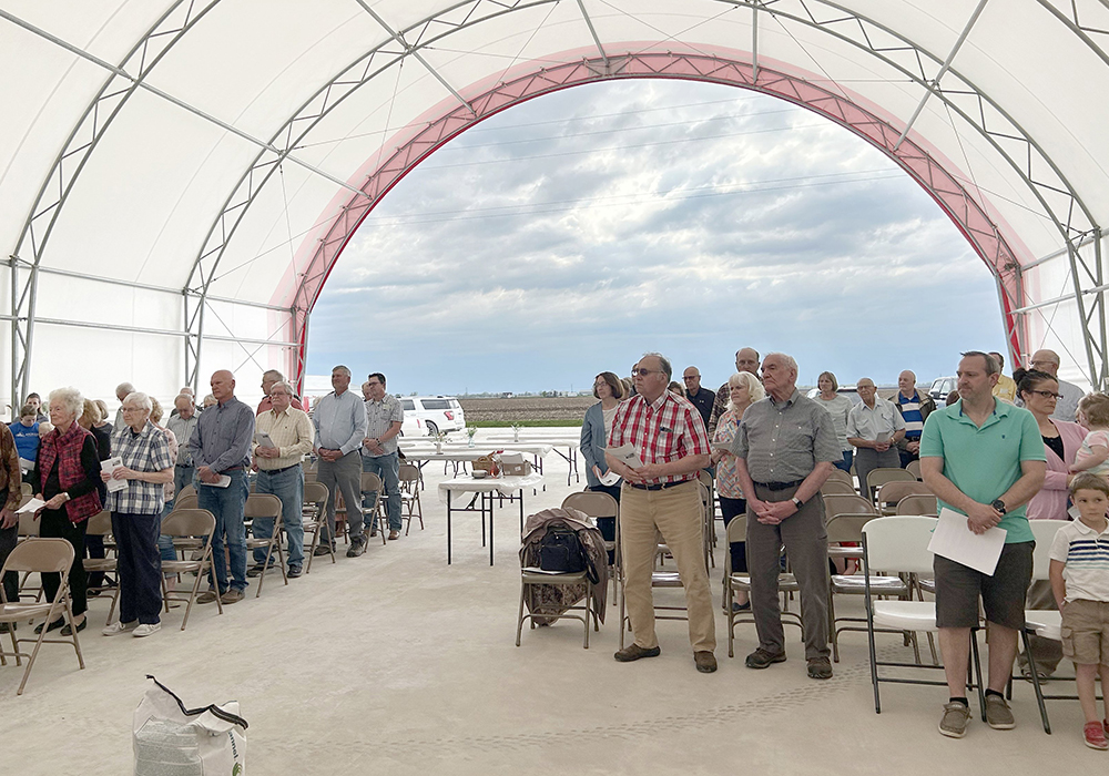 Worshippers pray in the hoop barn on the Pieper family farm in Donnellson, Iowa, during a Mass for the farm and the blessing of seeds April 15, 2023. Fr. Dan Dorau celebrated the Mass, whose inspiration comes from Catholic Rural Life. The four parishes he leads in Lee and Van Buren counties collaborated. (OSV News/The Catholic Messenger/Barb Arland-Fye)