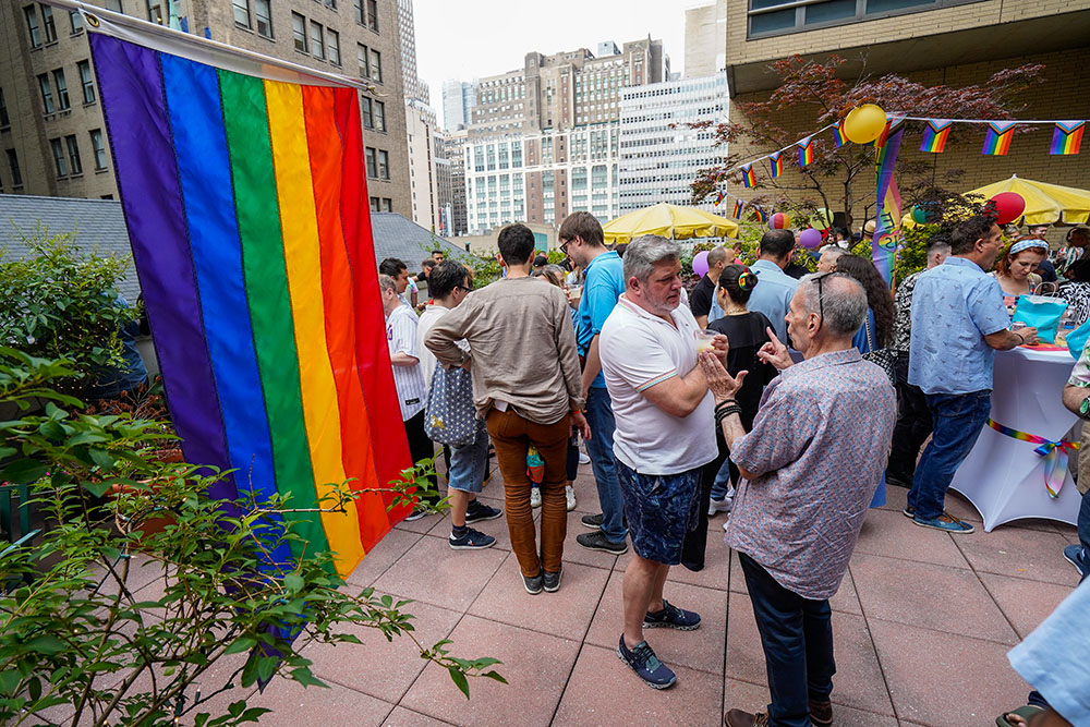 People gather for a rooftop reception at St. Francis of Assisi Church in New York City following the annual "Pre-Pride Festive Mass" June 29, 2024. The liturgy, hosted by the parish's LGBT+ ministry, is traditionally celebrated on the eve of the city's Pride parade. (OSV News/Gregory A. Shemitz)