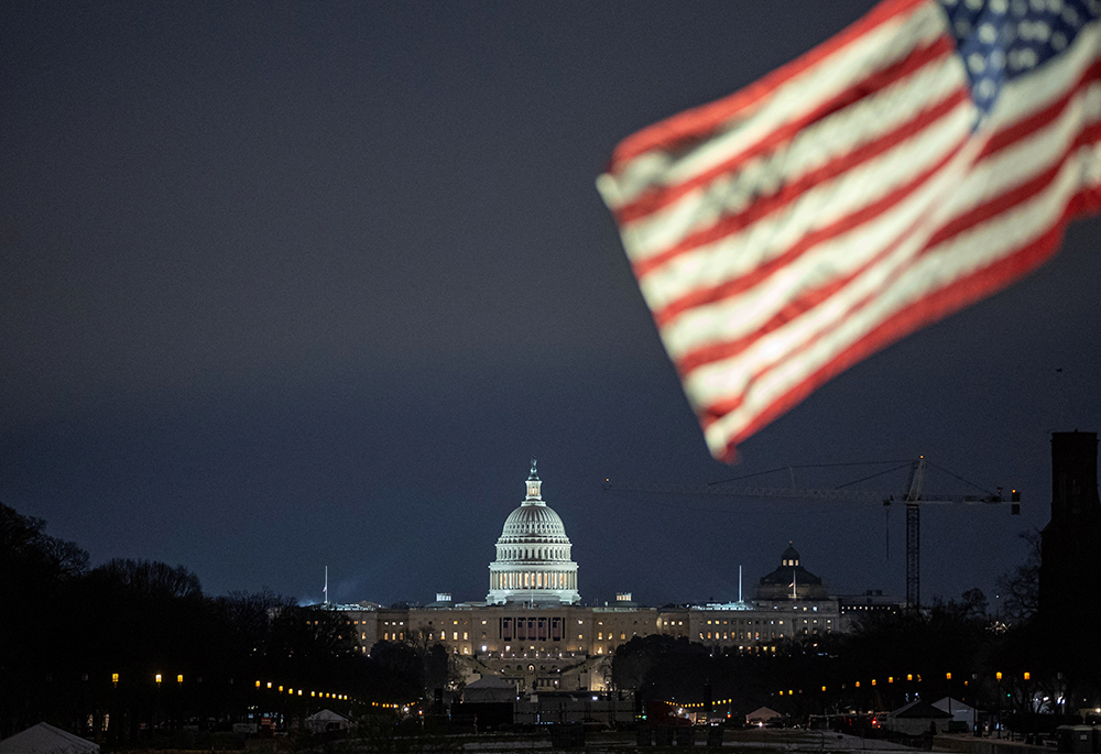 The U.S. flag flutters in front of the U.S. Capitol in Washington Jan. 16, 2025, ahead of the Jan. 20 presidential inauguration of then-U.S. President-elect Donald Trump. (OSV News/Reuters/Marko Djurica)
