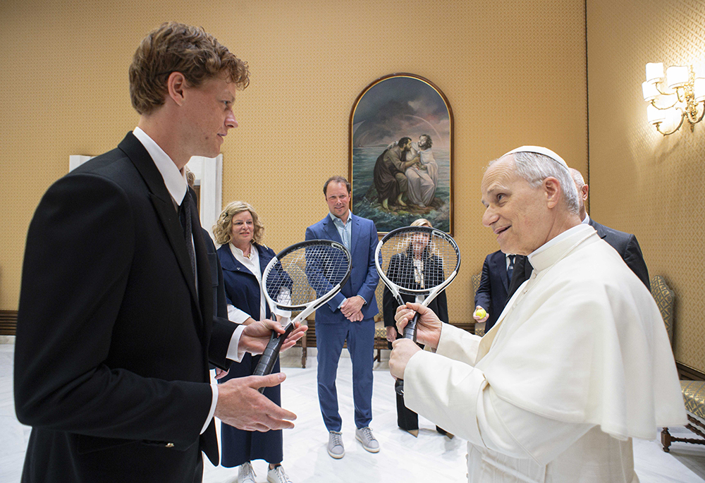 Pope Leo XIV speaks with Jannik Sinner, the No. 1 rated tennis player in the world, May 14, 2025, during a meeting at the Vatican. Jannik gave a racket to the pope, who likes to play tennis. (CNS/Vatican Media)