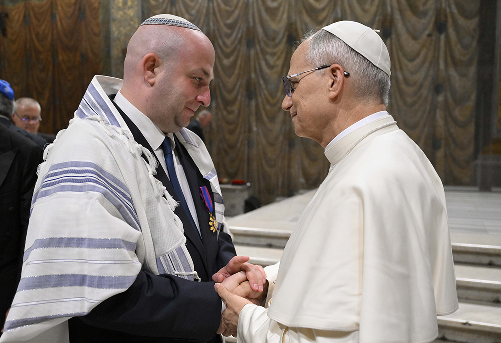 Pope Leo XIV greets Silviu Vexler, president of the Federation of Jewish Communities in Romania, during a ceremony honoring Blessed Iuliu Hossu in the Sistine Chapel at the Vatican June 2, 2025. (CNS photo/Vatican Media)