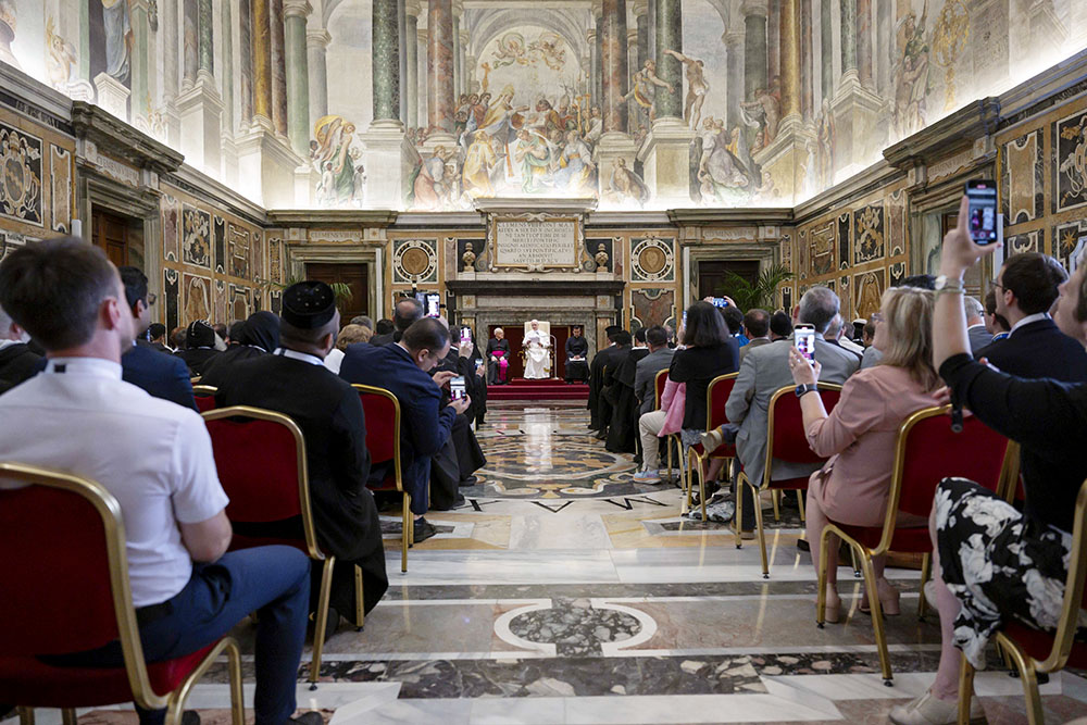Participants take photos of Pope Leo XIV during his audience with people attending a conference on the ecumenical implications of the 1,700th anniversary of the Council of Nicaea June 7, 2025, in the Clementine Hall of the Apostolic Palace at the Vatican. (CNS/Vatican Media)