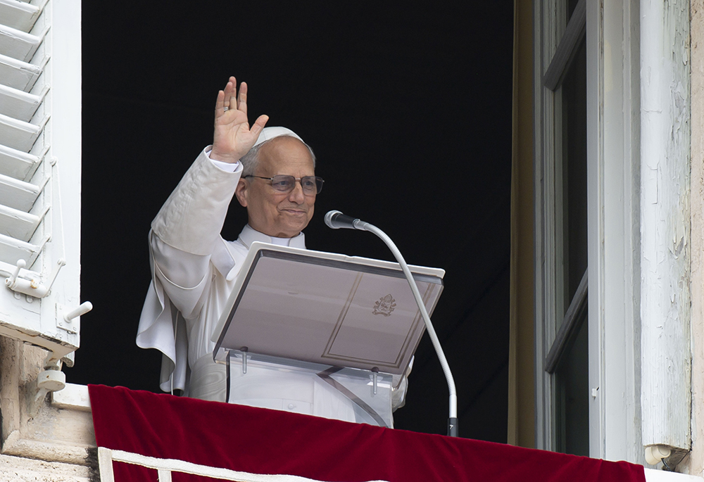 Pope Leo XIV waves to the crowd in St. Peter's Square at the Vatican as they join him for the recitation of the Angelus prayer and an appeal for peace hours after the U.S. bombed nuclear enrichment facilities in Iran June 22, 2025. (CNS/Vatican Media)