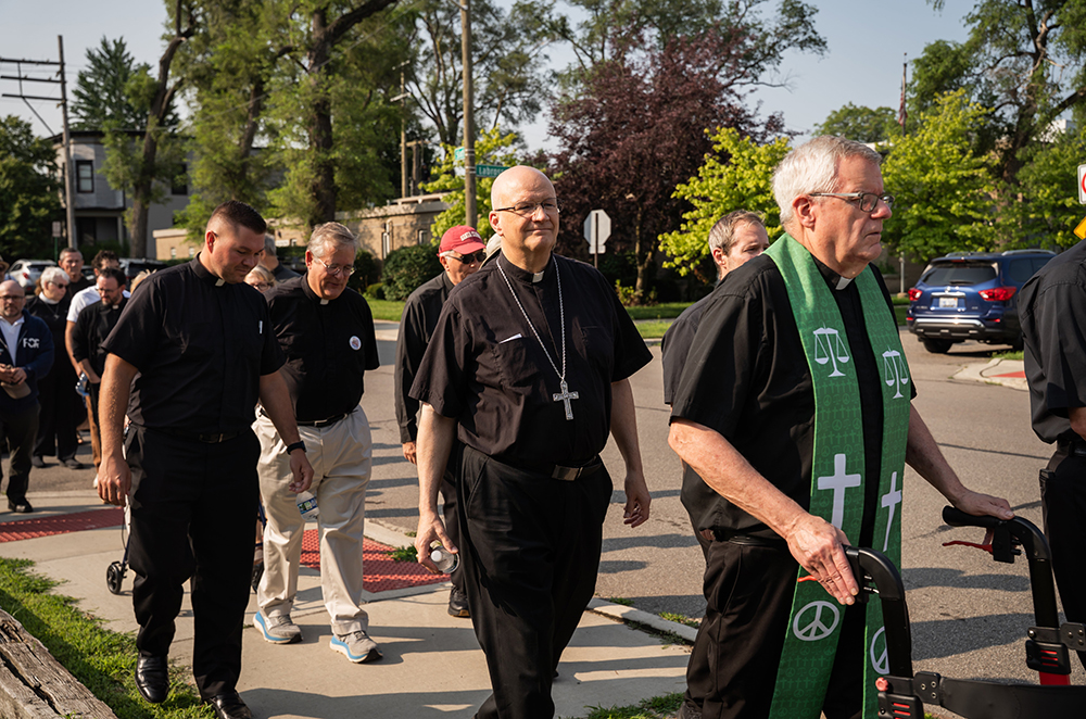 Detroit Archbishop Edward Weisenburger joins other clergy during a procession from Most Holy Trinity Church in Detroit's Corktown neighborhood to the ICE Regional Field Office on Michigan Avenue in downtown Detroit July 14, 2025. The procession was organized by Strangers No Longer, a Catholic grassroots immigrant rights advocacy group. (OSV News/Detroit Catholic/Valaurian Waller)