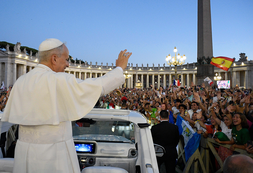 Pope Leo XIV greets visitors and pilgrims from the popemobile as he rides through St. Peter’s Square at the conclusion of an evening Mass celebrated by Archbishop Rino Fisichella, pro-prefect of the Dicastery for Evangelization, as part of the Jubilee of Youth at the Vatican July 29, 2025. (CNS/Vatican Media)