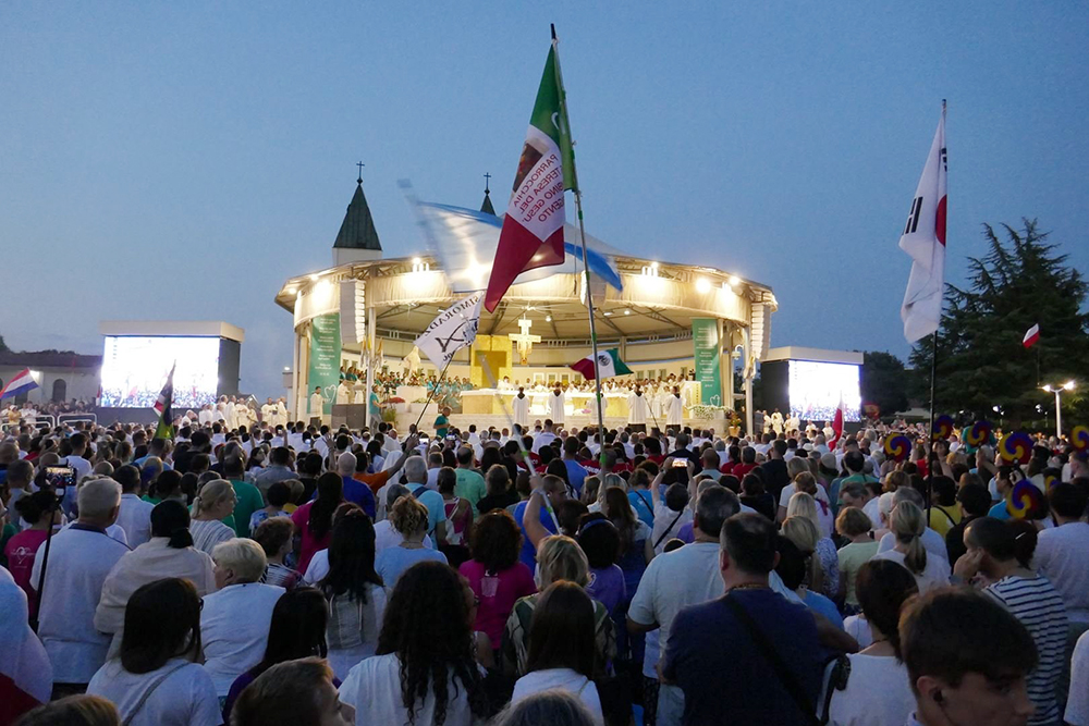 Young people and others gather for prayer behind the Church of St. James in Medjugorje, Bosnia-Herzegovina, in this file photo from the 2024 international youth festival known as Mladifest. Pope Leo XIV sent a message to this year's festival, which is being held Aug. 4-8, 2025. (CNS/Courtesy Mladifest)