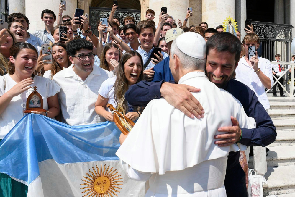 Pope Leo XIV hugs a pilgrim from Argentina after his weekly general audience Aug. 6, 2025, in St. Peter's Square at the Vatican. (CNS photo/Vatican Media)