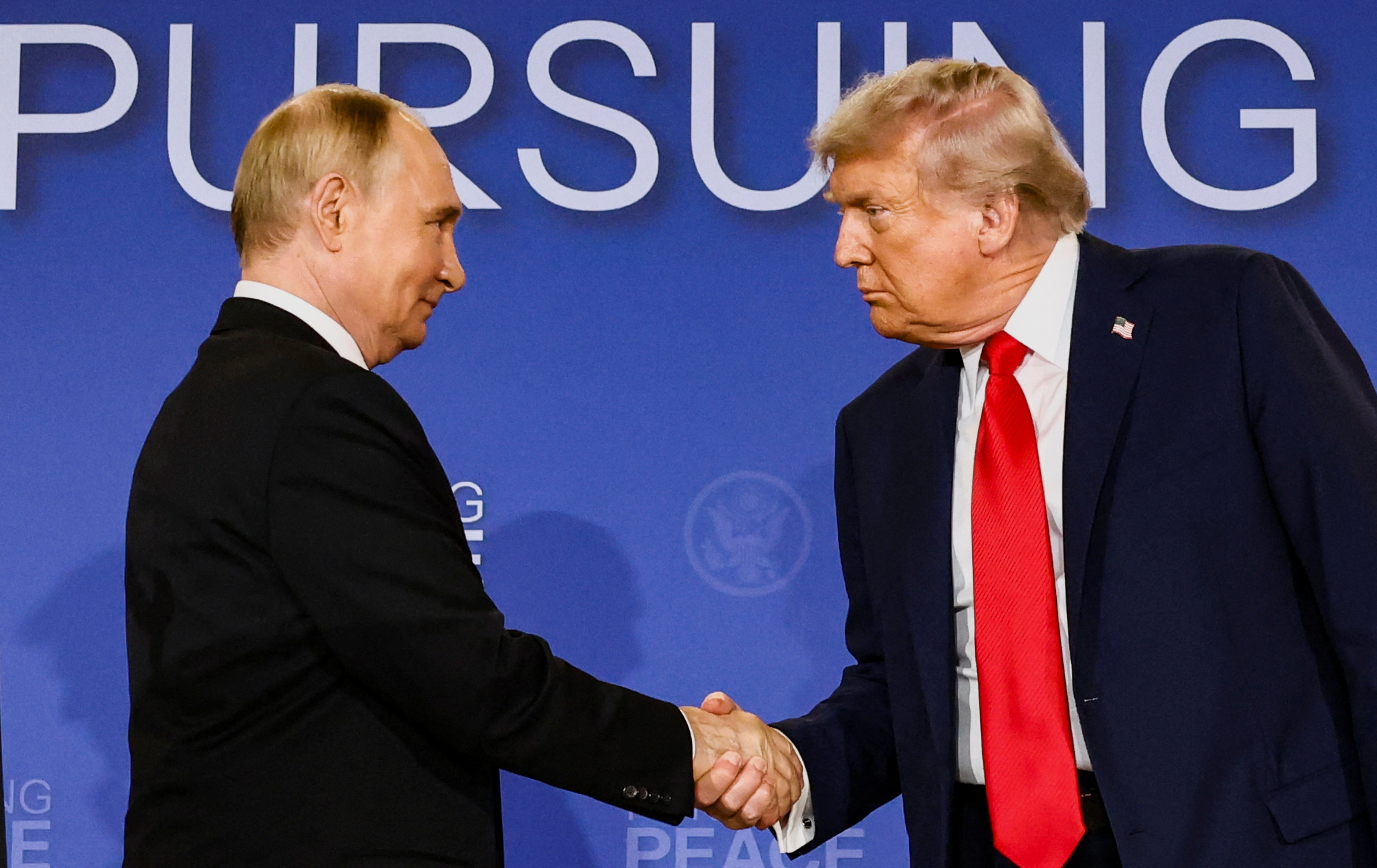 U.S. President Donald Trump and Russian President Vladimir Putin shake hands during a press conference following their meeting to negotiate an end to the war in Ukraine, at Joint Base Elmendorf-Richardson, in Anchorage, Alaska, Aug. 15, 2025. (OSV News photo/Kevin Lamarque, Reuters)