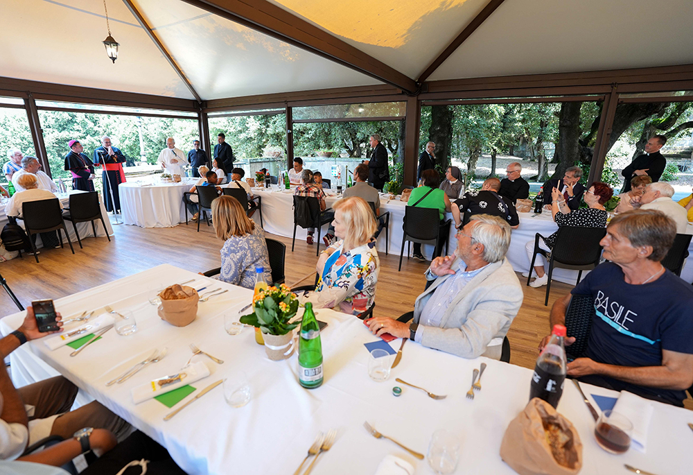 Pope Leo XIV speaks to guests assisted by the Albano diocesan Caritas agency during a luncheon at the Borgo Laudato Si’ in Castel Gandolfo, Italy, Aug. 17, 2025. The words of the diocesan bishop of Albano, Bishop Vincenzo Viva, captured Michael Sean Winters' attention. (CNS/Lola Gomez)
