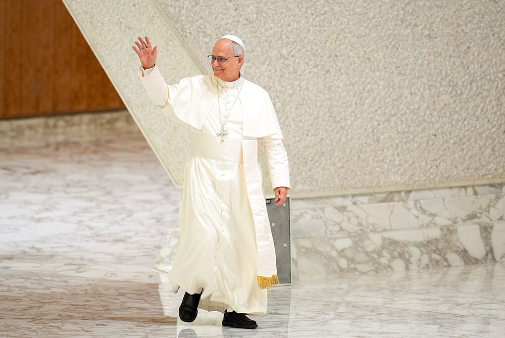 Pope Leo XIV greets visitors and pilgrims as he arrives in the Paul VI Audience Hall at the Vatican for his weekly general audience Aug. 20, 2025. (CNS/Lola Gomez)
