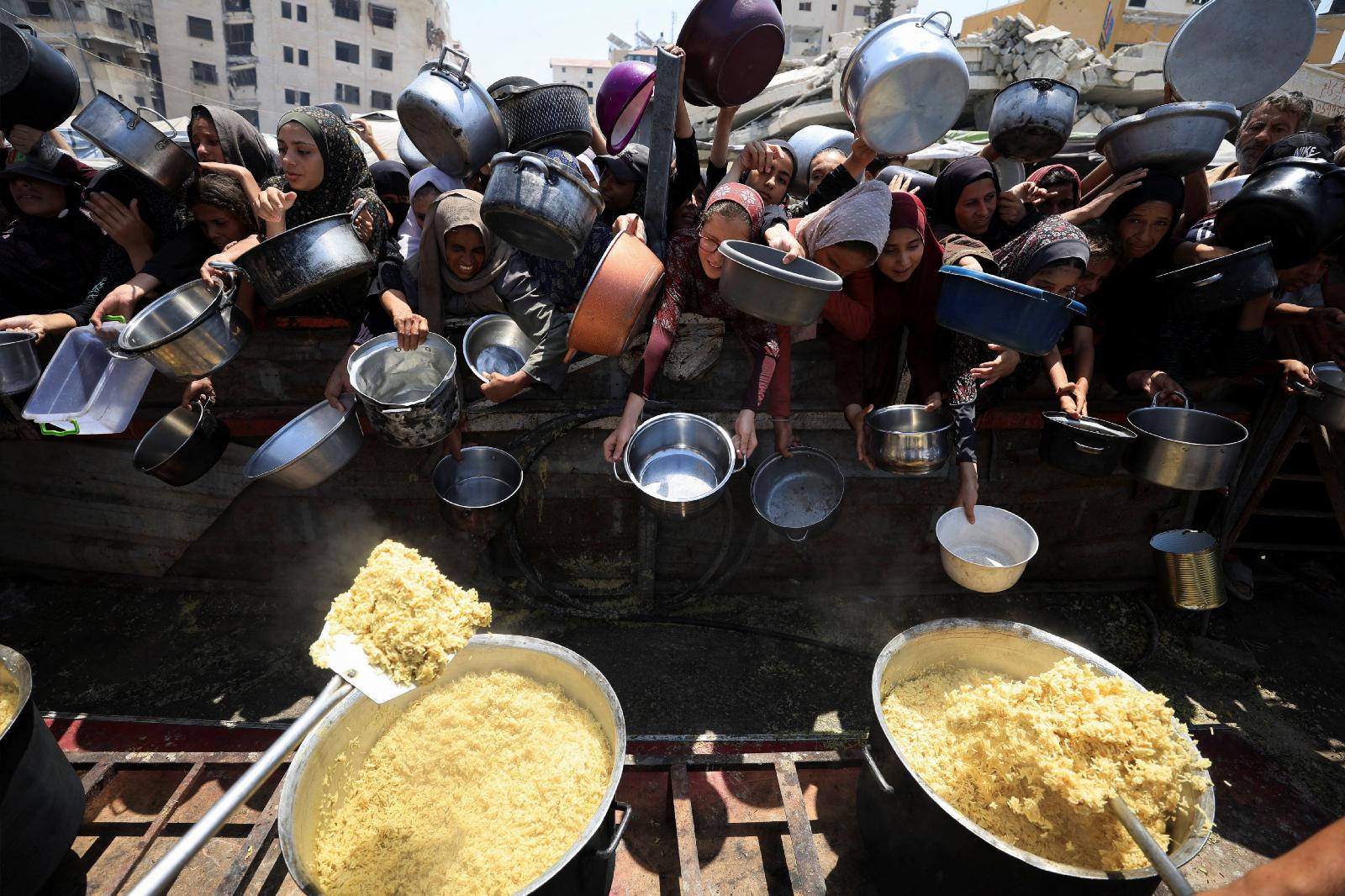 Palestinians wait to receive food from a charity kitchen in the Gaza Strip's Gaza City Aug. 15, 2025. (OSV News/Reuters/Dawoud Abu Alkas)