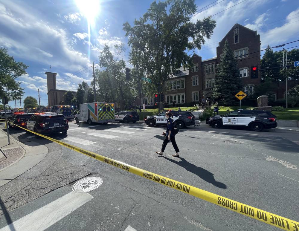 First responders block off the crime scene following a mass shooting at Annunciation Catholic School in Minneapolis Aug. 27, 2025. The Richfield Police Department is reporting there are up to 20 victims; two children and the suspected gunman are dead. (OSV News/The Catholic Spirit/Dave Hrbacek)
