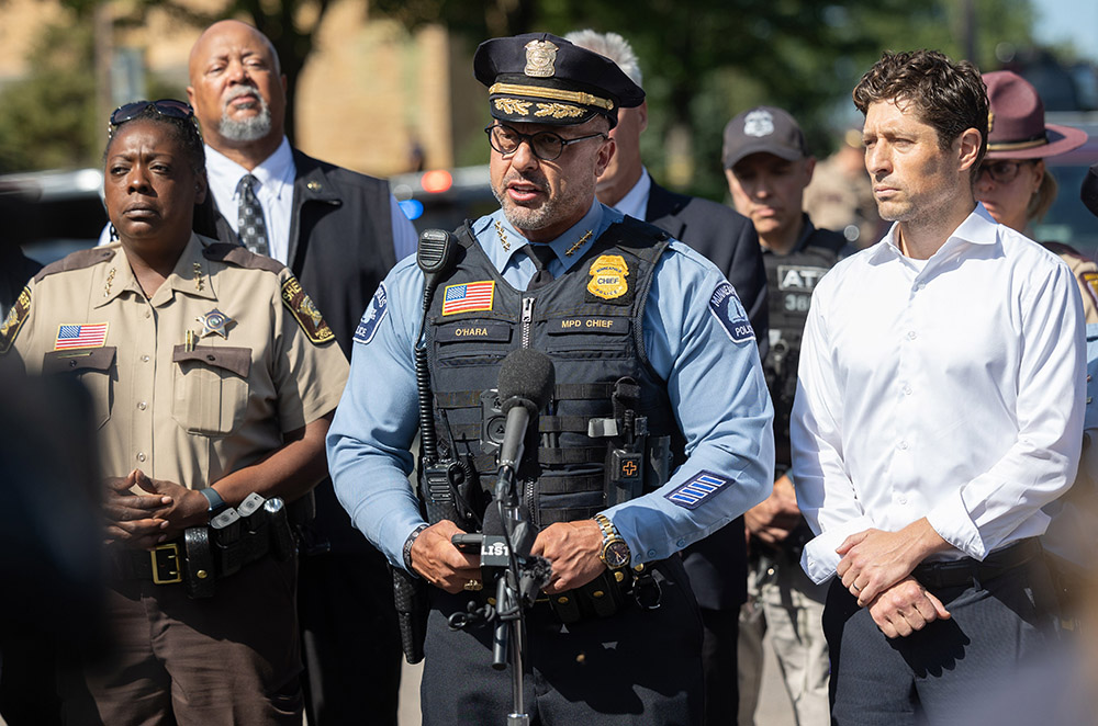 Minneapolis Police Chief Brian O'Hara, alongside Mayor Jacob Frey, right, addresses the media outside Annunciation Catholic School following a shooting Aug. 27, 2025. A shooter opened fire with a rifle through the windows of the school church and struck children celebrating Mass during the first week of school, killing two and wounding 17 people in an act of violence the police chief called “absolutely incomprehensible.” (OSV News/The Catholic Spirit/Dave Hrbacek)