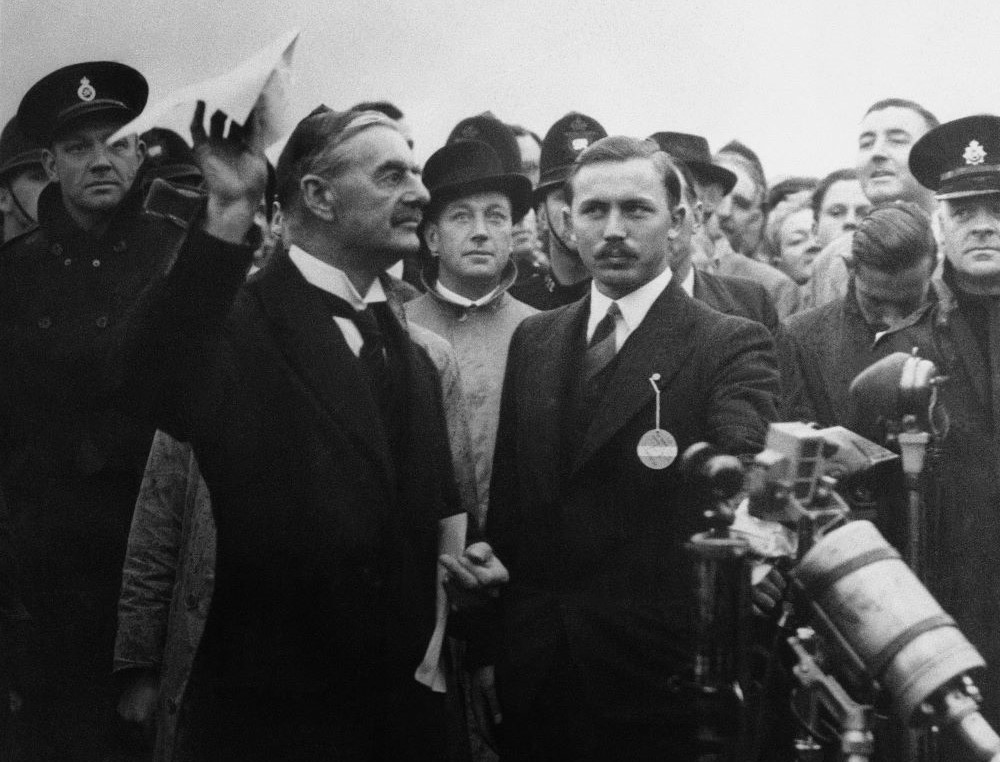 British Premier Neville Chamberlain waves what he called the "no war" pact at Heston Aerodrome in London Sept. 30, 1938.