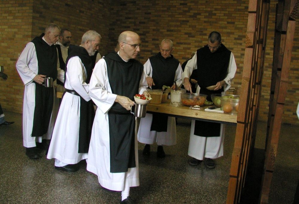 Trappist monks line up for lunch. 