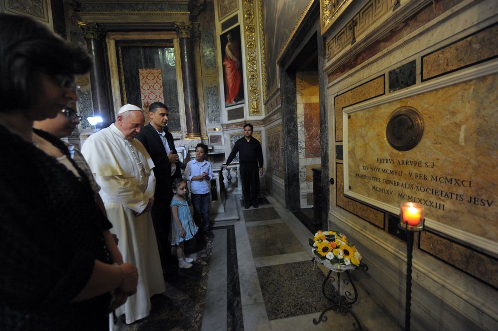 Pope Francis prays at the tomb of Jesuit Fr. Pedro Arrupe. 