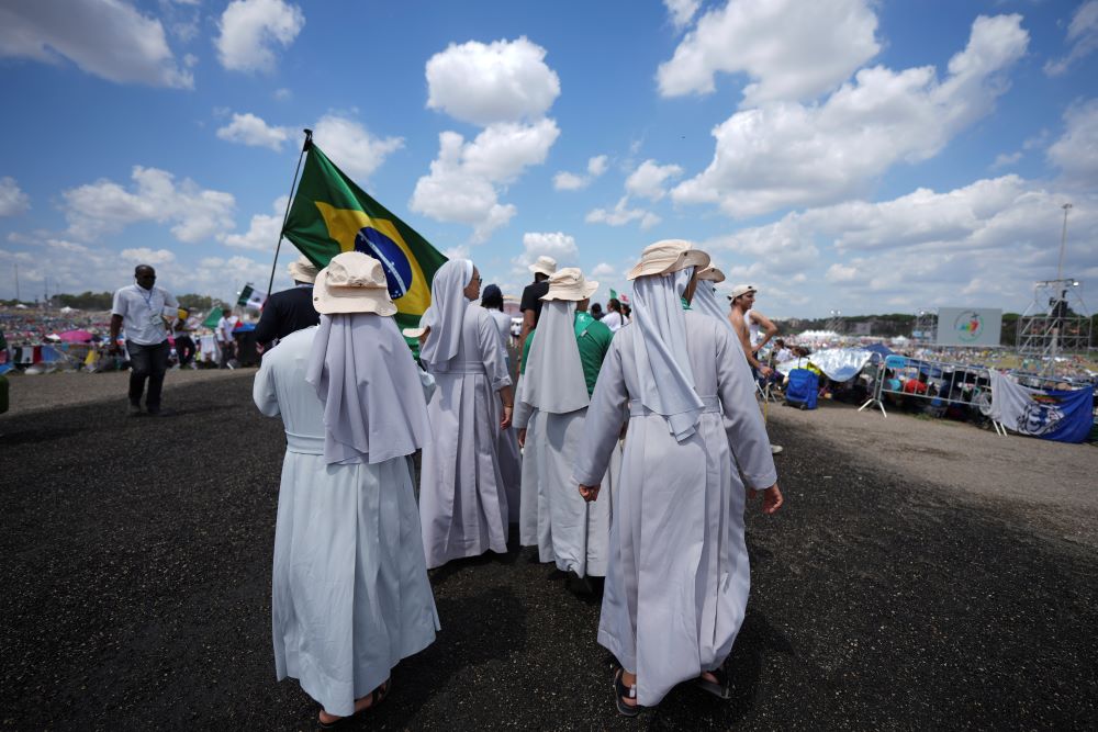 People dressed in white on pilgrimmage