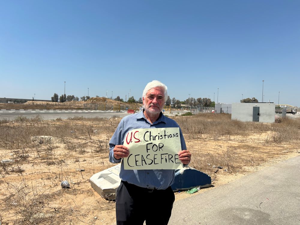 Ken Butigan protests at the border of Gaza.