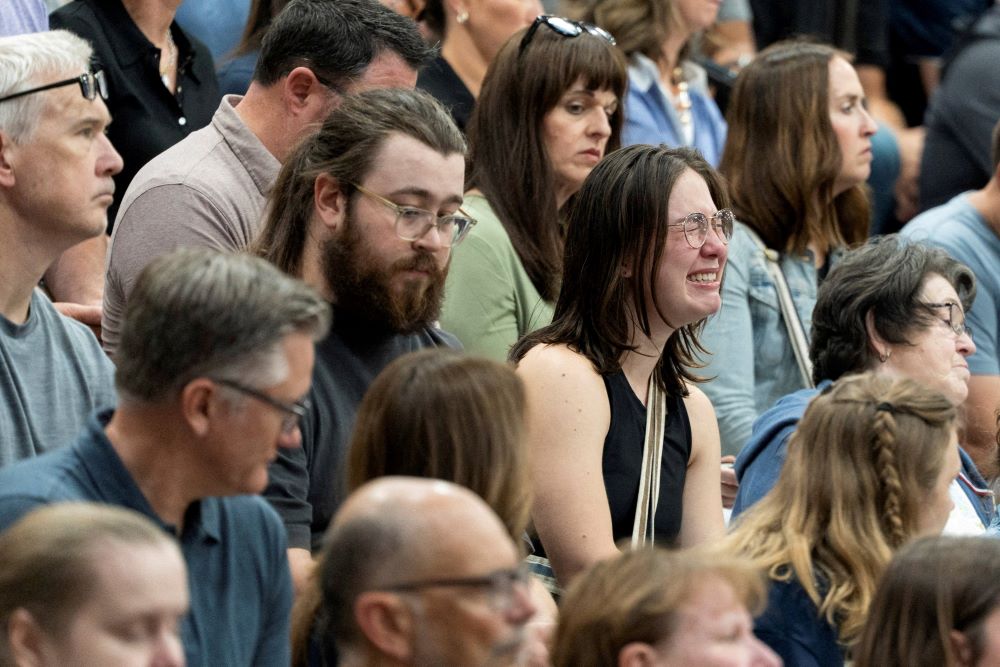 A woman cries during prayer vigil. 