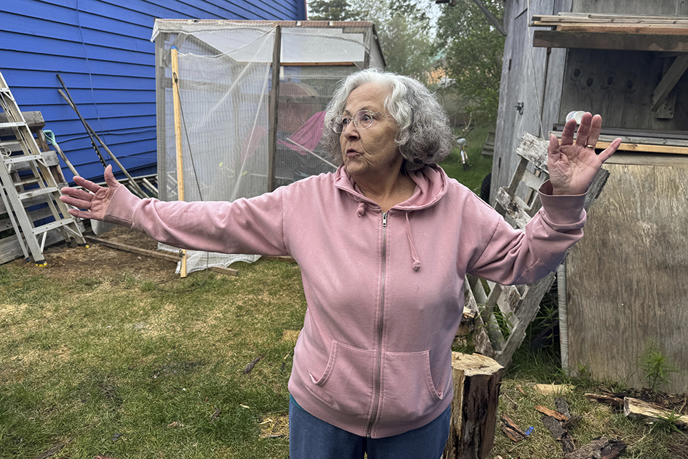 Gloria Simeon, co-founder of the Mother Kuskokwim Tribal Coalition, speaks during an interview outside her smokehouse in Bethel, Alaska, on June 18, 2025. (AP/Mark Thiessen)