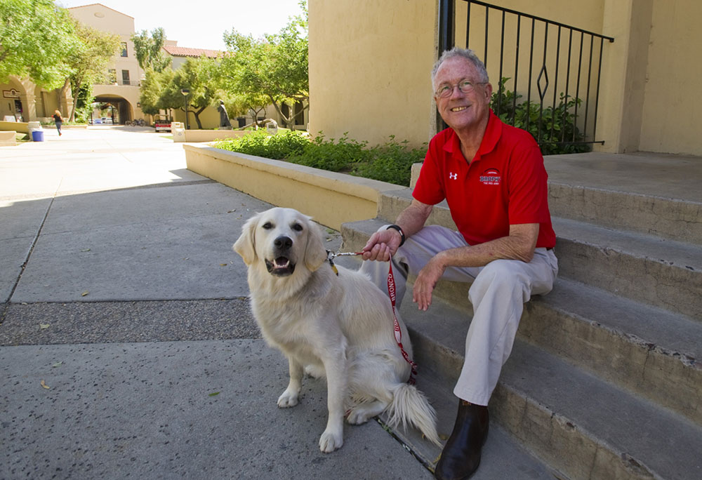 Edward Reese with his dog at Brophy Prep in Phoenix (RNS/Courtesy photo)