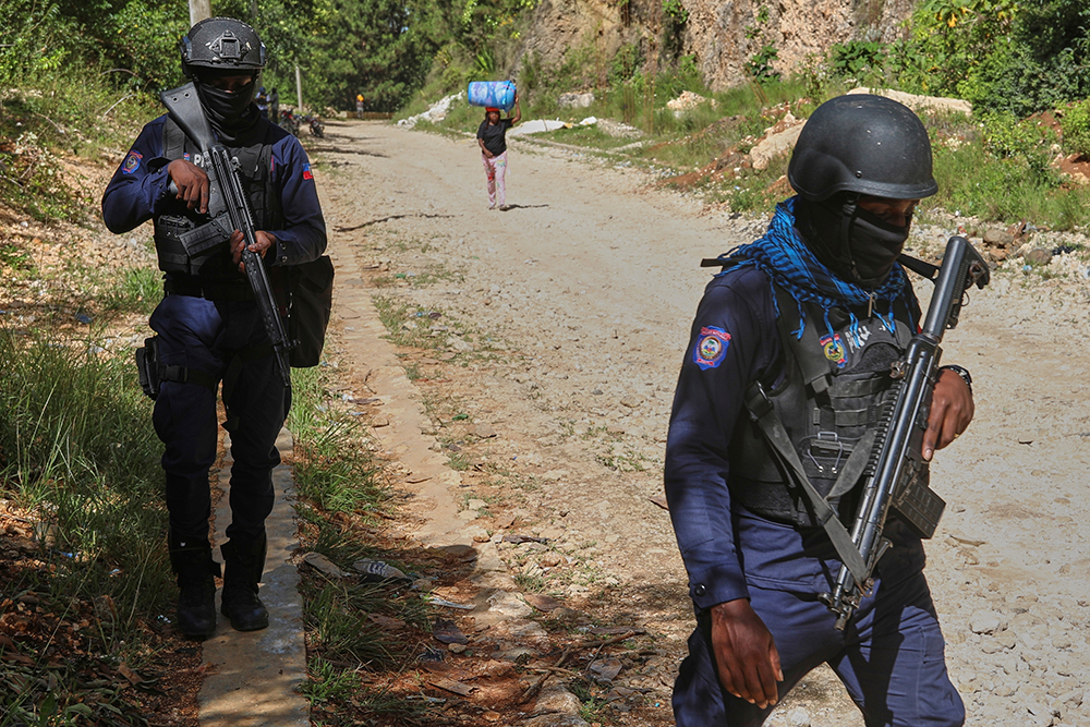 Police officers patrol the area near the Saint-Helene orphanage in the Kenscoff neighborhood of Port-au-Prince, Haiti, Aug. 4, 2025. (AP Photo/Odelyn Joseph)
