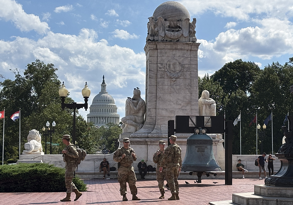National Guard troops walk on Columbus Circle plaza in front of Union Station in Washington, D.C., on Aug. 25, 2025. (NCR photo/James V. Grimaldi)