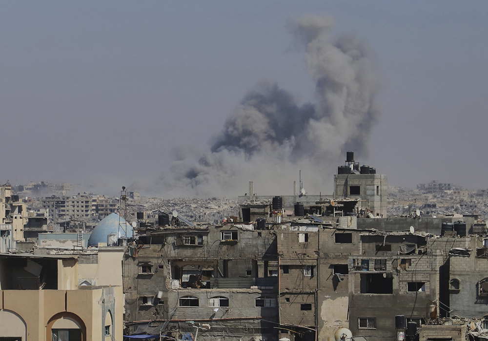 Smoke rises to the sky following an Israeli army airstrike in Khan Younis, in the Gaza Strip, Aug. 18, 2025, the day Fr. Gabriel Romanelli, pastor of Holy Family Church in Gaza, received an evacuation order. (AP photo/Mariam Dagga)