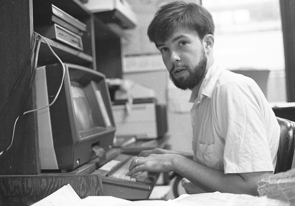 Joe Feuerherd, intern and future NCR publisher and editor, works in NCR's Washington Bureau office in 1984. (NCR photo/Steve Askin)
