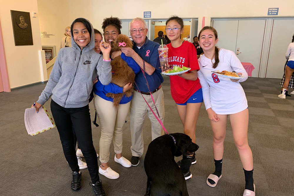 Edward Reese with his dogs Ginger and Rodger at lunch with students at St. Ignatius College Prep in San Francisco in 2019 (RNS/Courtesy of Thomas Reese)