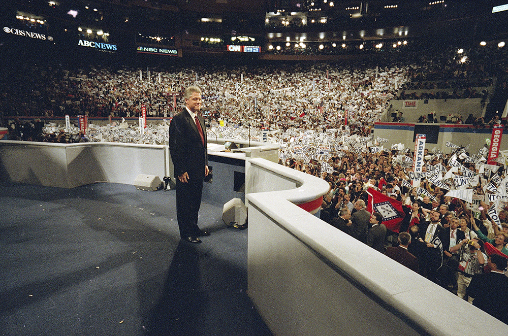 Democratic presidential nominee Bill Clinton faces a cheering audience after taking the podium to deliver his acceptance speech as his party's presidential nominee during the Democratic National Convention at Madison Square Garden in New York, July 16, 1992. (AP Photo/Stephan Savoia, File)
