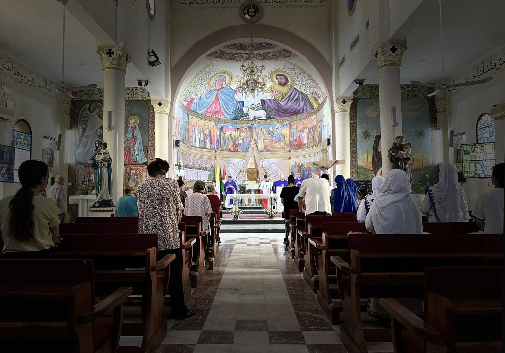 Fr. Gabriel Romanelli, pastor of the only Catholic church in Gaza, celebrates Mass on Aug. 18, the day he received an evacuation notice by the Israeli Defense Forces. (Courtesy of Fr. Gabriel Romanelli)