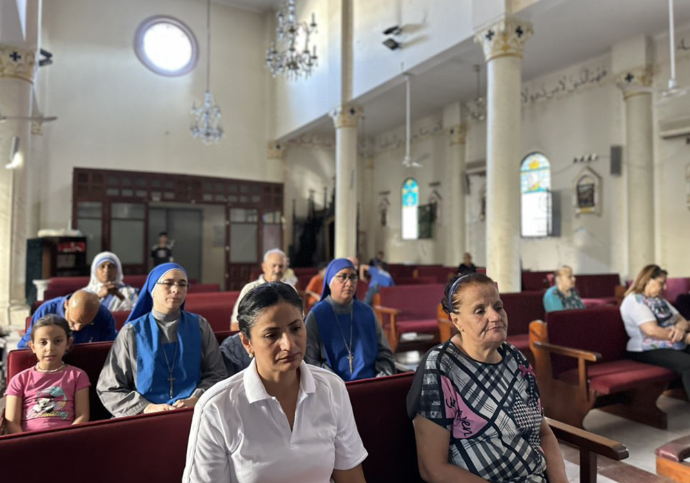 Catholics at Holy Family Church in Gaza pray the rosary on Aug. 18, the day Fr. Gabriel Romanelli received an evacuation order by the Israeli Defense Forces. (Courtesy of Fr. Gabriel Romanelli)