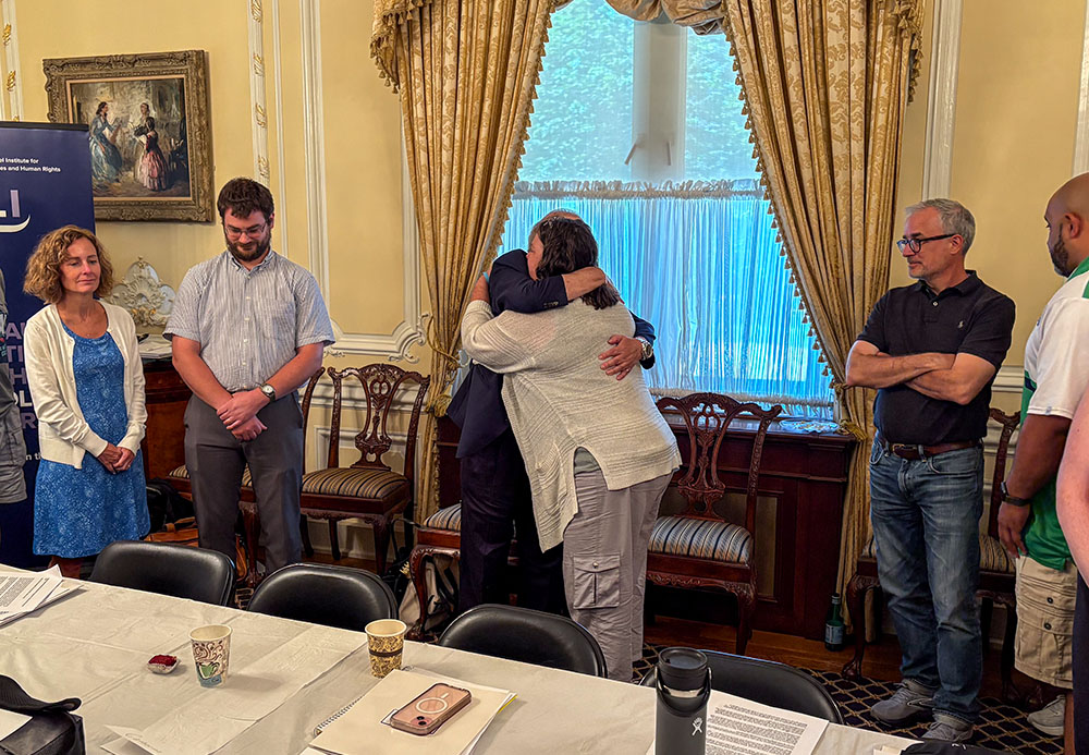 Catholic teachers individually hug Abraham Foxman during a seminar organized by the Olga Lengyel Institute for Holocaust Studies and Human Rights in New York, July 25, 2025. Foxman is a Holocaust survivor who had been hidden by a Catholic community (NCR photo/Camillo Barone)