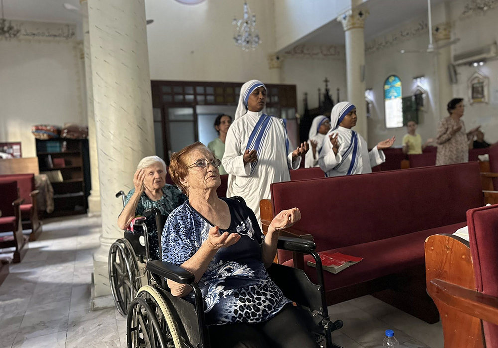 Catholics at Holy Family Church in Gaza pray the rosary on Aug. 18, the day Fr. Gabriel Romanelli received an evacuation order by the Israeli Defense Forces. (Courtesy of Fr. Gabriel Romanelli)