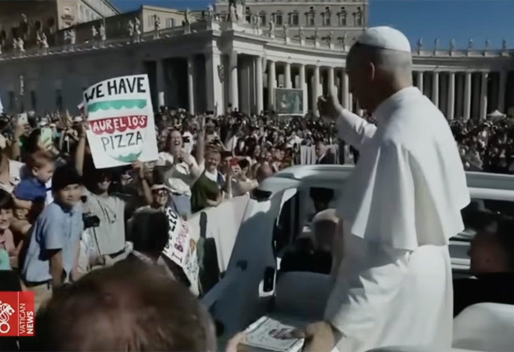 Pope Leo XIV receives deep-dish pizza from Aurelio's in Chicago during an encounter at his general audience at the Vatican July 30, 2025. (NCR screengrab/YouTube/Vatican News)