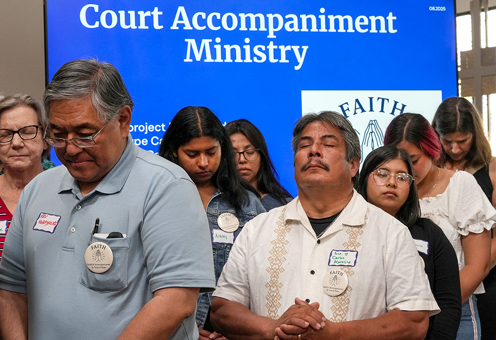 Court accompaniment volunteers gather for a blessing at the Pastoral Center of the San Diego Diocese, at the launch of "FAITH" — "Faithful Accompaniment In Trust & Hope" — a program to make sure refugees and asylum seekers are not alone at immigration hearings. (Chris Stone)
