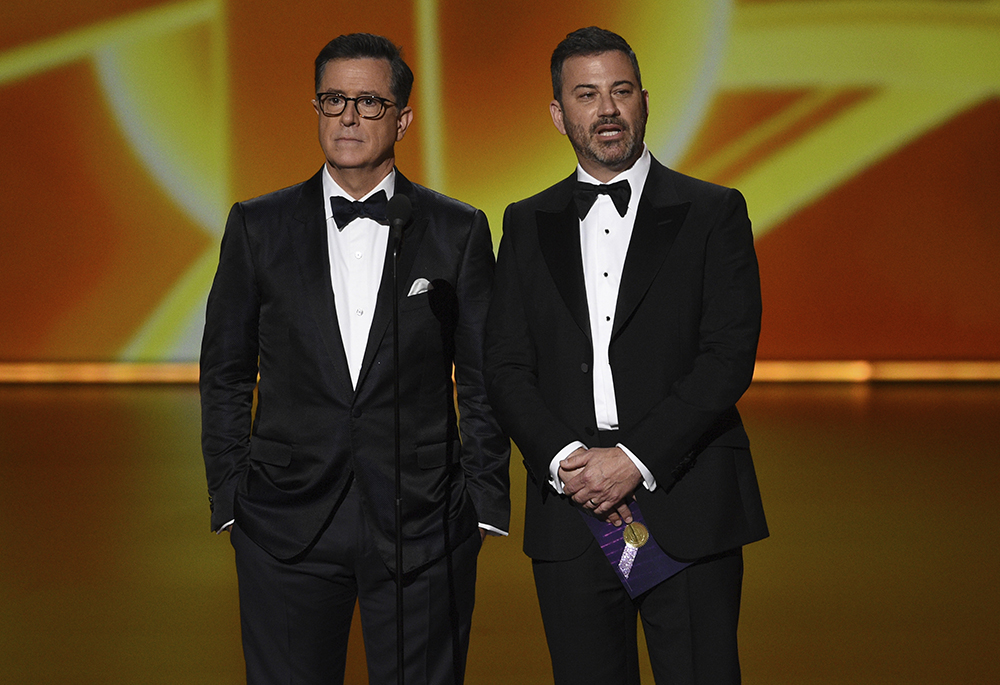 Stephen Colbert, left, and Jimmy Kimmel present the award for outstanding lead actress in a comedy series at the 71st Primetime Emmy Awards on Sunday, Sept. 22, 2019, at the Microsoft Theater in Los Angeles. (AP/InvisionChris Pizzello)