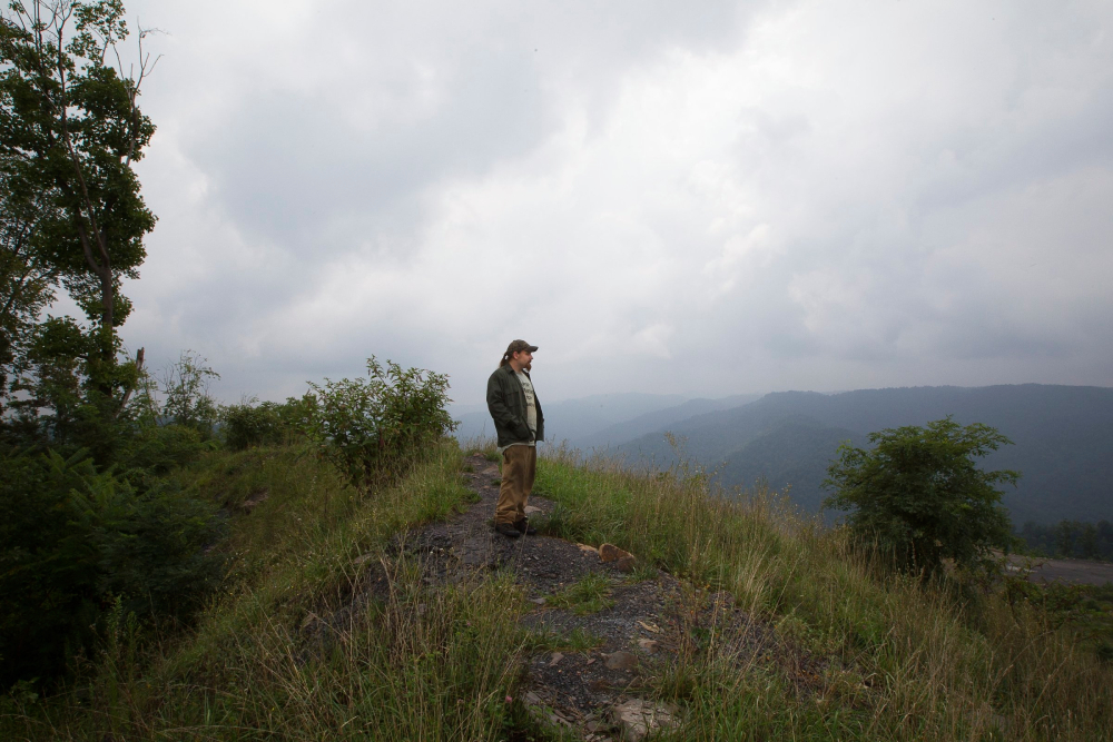 A man in Naoma, W. Va., is seen near the a mountaintop removal coal mine on Kayford Mountain Aug. 19, 2014. The Catholic Committee of Appalachia, a membership-based organization, has served Appalachia, the poor and creation since 1970. (CNS / Tyler Orsburn)