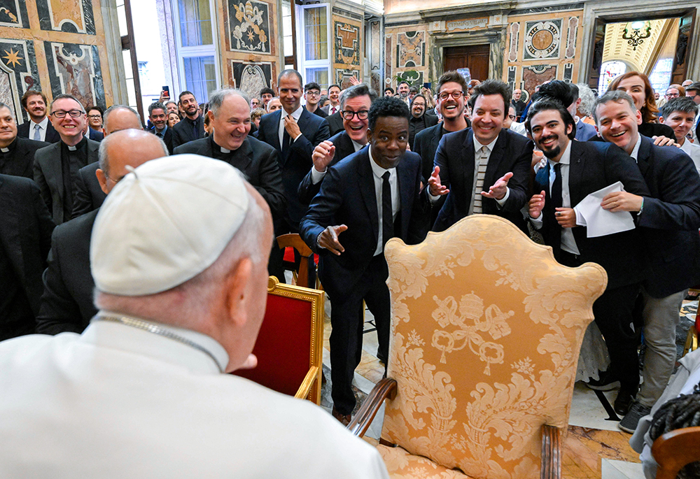 Pope Francis engages in a light-hearted moment with comedians Stephen Colbert, Chris Rock, Jimmy Fallon and other comedians after an audience at the Vatican June 14, 2024. (CNS/Vatican Media)