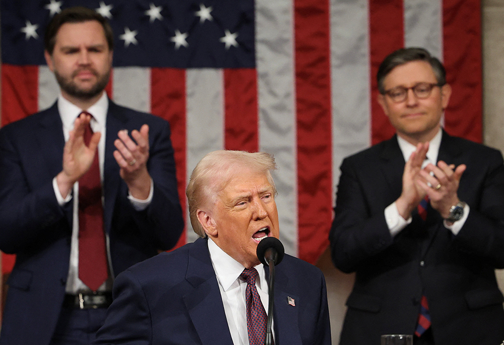 U.S. Vice President JD Vance and House Speaker Mike Johnson, R-La., applaud as President Donald Trump addresses a joint session of Congress at the U.S. Capitol in Washington March 4, 2025. (OSV News/Reuters/Win McNamee)
