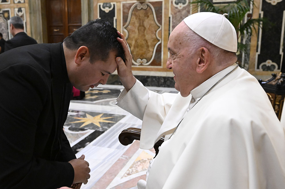 Pope Francis blesses a member of the National Association of Hispanic Priests after a meeting in the Clementine Hall of the Apostolic Palace at the Vatican Nov. 16, 2023. (OSV News/Vatican Media)