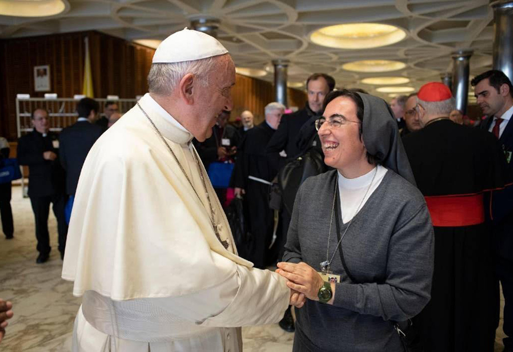 Salesian Sr. Alessandra Smerilli, secretary of the Dicastery for Promoting Integral Human Development, is pictured meeting Pope Francis at the Vatican in an undated photo. Francis named Sister Alessandra to her post in 2021, first as undersecretary then as secretary. Francis died April 21, 2025, at age 88. (CNS/Vatican Media, courtesy of Dicastery for Promoting Integral Human Development)