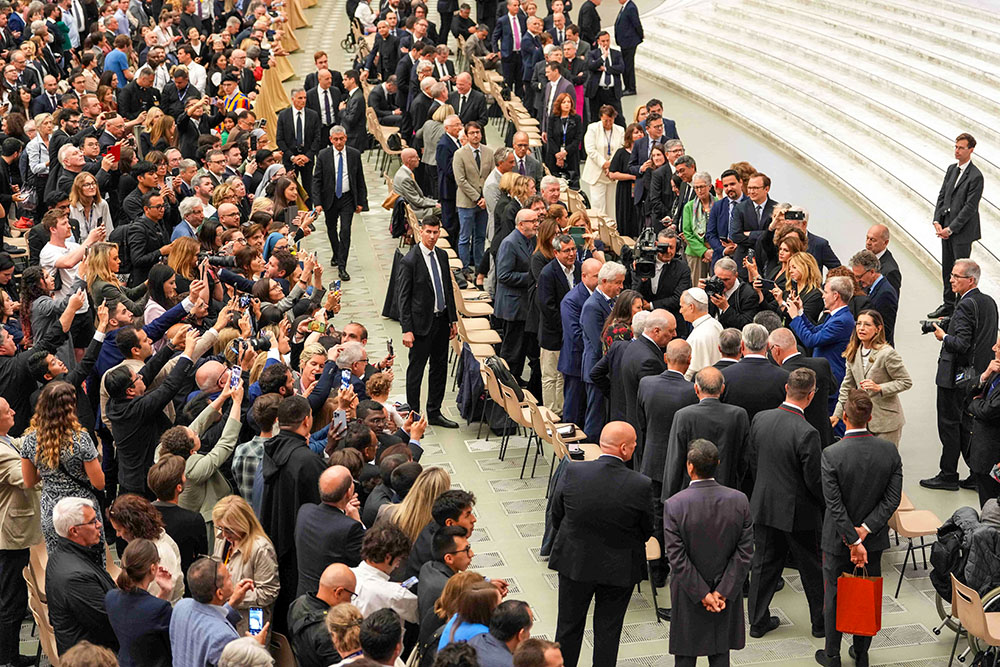 Pope Leo XIV greets representatives of the media who covered his election in the Paul VI Audience Hall at the Vatican May 12, 2025. (CNS/Lola Gomez)