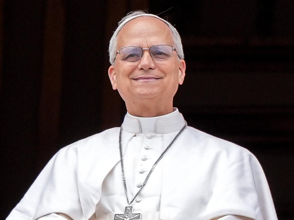 Pope Leo XIV looks out to the crowd from the central balcony of St. Peter’s Basilica at the Vatican as he leads the midday recitation of the “Regina Coeli” prayer for the first time May 11, 2025. (CNS/Lola Gomez)