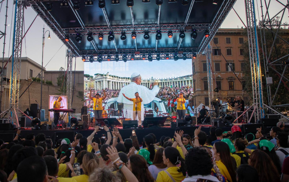 A band performs in front of an image of Pope Leo XIV displayed on a large screen during a festival in Risorgimento Square in Rome July 29, 2025, as part of the Jubilee of Digital Missionaries and Catholic Influencers. (CNS/Pablo Esparza)